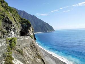 a cliff next to the ocean with a beach at Hualien Seaside B&B in Hualien City