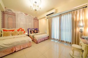 Postel nebo postele na pokoji v ubytování 維瑜的家五館