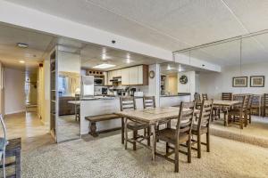 a dining room and kitchen with a table and chairs at Rainbow Condos II in Ocean City