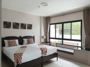 Llit o llits en una habitació de Double Tree Residence