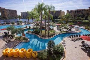 a large swimming pool in a resort with a resort at Club Wyndham Bonnet Creek Resort with Disney shuttles and near Universal Studios in Orlando