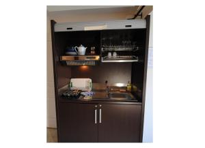 A kitchen or kitchenette at Logis Hostellerie du Perigord Vert