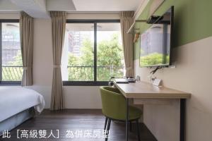 Un pat sau paturi într-o cameră la Hotel Kuei