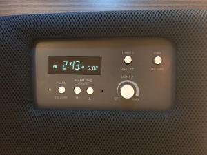 an oven with a clock on the front of it at Cabin & Capsule Hotel J-SHIP Osaka Namba in Osaka