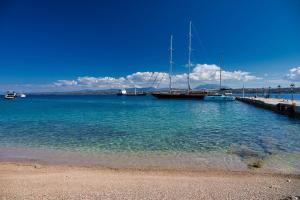 a group of boats docked at a dock in the water at Aria Apartments in Spetses