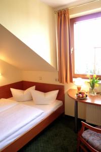 
Cama o camas de una habitación en Landhotel Dresden
