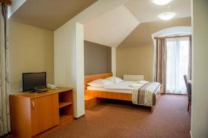 Postel nebo postele na pokoji v ubytování Wellness Hotel Thermal