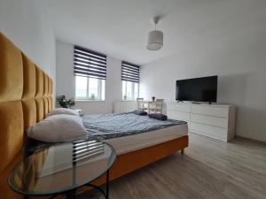 Ένα ή περισσότερα κρεβάτια σε δωμάτιο στο Perfect Stay - "Apartamenty Horzyca"