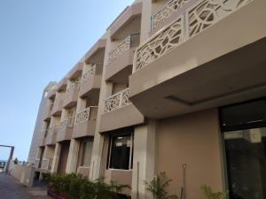 a building with balconies on the side of it at HOTEL NILADRI PREMIUM in Puri