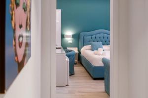 Postel nebo postele na pokoji v ubytování Tiffany Suites