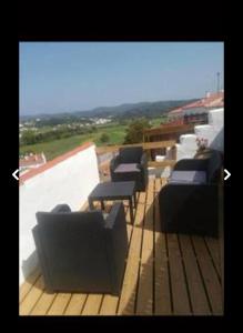 a row of couches sitting on top of a roof at Casinhas Proença in Aljezur