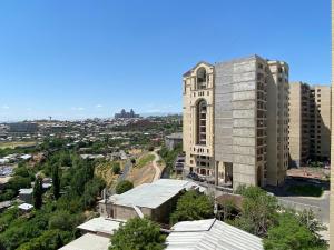 a tall building with a tower in a city at Argishti street, 2 bedrooms Spacious, Sunny apartment GL148 in Yerevan