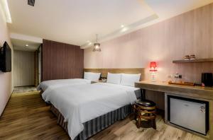 Katil atau katil-katil dalam bilik di Lan Kwai Fong Garden Hotel