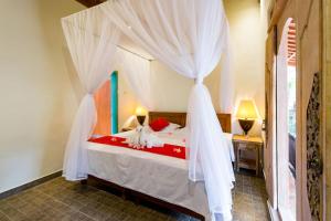 Ein Bett oder Betten in einem Zimmer der Unterkunft Umasari Rice Terrace Villa by AGATA