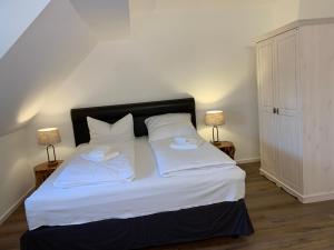 Un pat sau paturi într-o cameră la Spreezeit Hotel connect