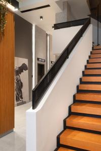 a staircase in a house with wooden steps at 11 Enteka Acropolis Suites in Athens