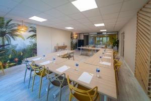 a large conference room with a long table and chairs at Sure Hotel by Best Western Beziers Le Monestie in Béziers