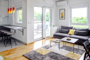 a living room with a couch and a table at Blue Sky in Čakovec