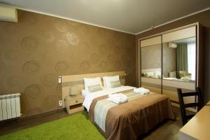 Ліжко або ліжка в номері Green Park Kaluga Hotel