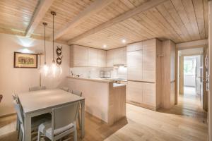 A kitchen or kitchenette at Dossau By Totiaran