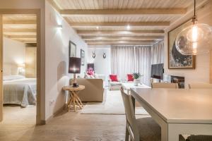A bed or beds in a room at Dossau By Totiaran