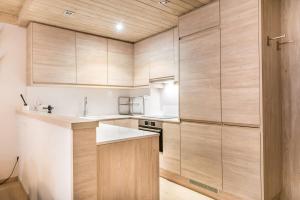 A kitchen or kitchenette at Dossau By Totiaran