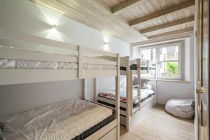 A bed or beds in a room at Dossau By Totiaran