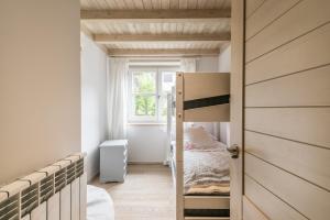 A bed or beds in a room at Dossau By Totiaran
