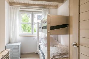 A bed or beds in a room at Dossau By Totiaran