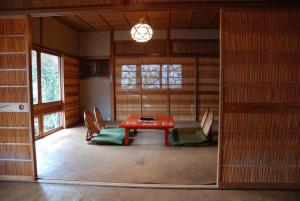 a room with a table and chairs in a room at Yadoya Manjiro in Kyoto