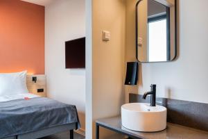 Postel nebo postele na pokoji v ubytování Citybox Antwerp