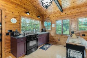a kitchen with wooden walls and a wooden ceiling at Peterson Mill in Saugatuck