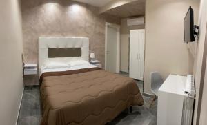 Postel nebo postele na pokoji v ubytování Hotel stranamore