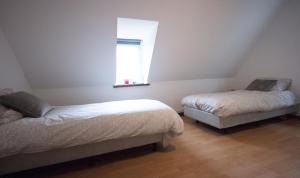 
Een bed of bedden in een kamer bij Logies De Witte Hoeve
