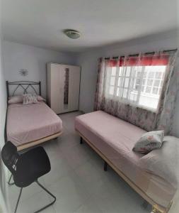 Postel nebo postele na pokoji v ubytování Tango House