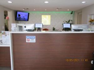 a counter in a store with two computers on it at Quality Inn & Suites By The Lake in Orlando