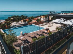 a large body of water with a large building at Marvie Hotel & Health in Split