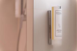a white refrigerator with a box on the door at Maison Axel Opéra Paris in Paris