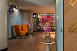 TV a/nebo společenská místnost v ubytování Novotel Santiago Las Condes