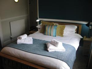 Cama o camas de una habitación en The Swan Inn