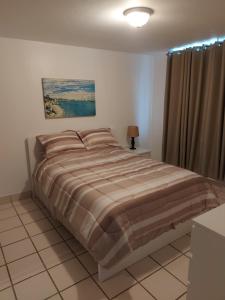 Postel nebo postele na pokoji v ubytování Condado San Juan Prime location 5minsWalk To Beach