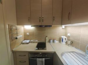 A kitchen or kitchenette at Gioiello di Corfu apartment