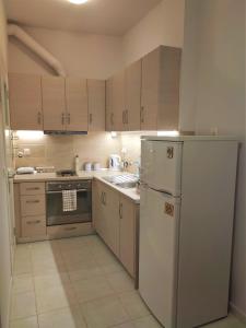 A kitchen or kitchenette at Gioiello di Corfu apartment