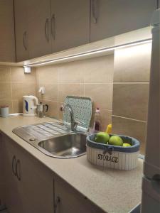 A kitchen or kitchenette at Gioiello di Corfu apartment