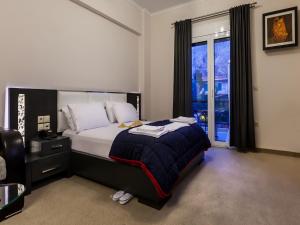 Posteľ alebo postele v izbe v ubytovaní Pearl Bay Hotel Apartments