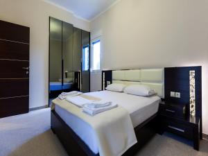 Posteľ alebo postele v izbe v ubytovaní Pearl Bay Hotel Apartments