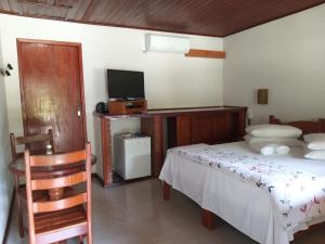Cama ou camas em um quarto em Pousada Caminho das Candeias
