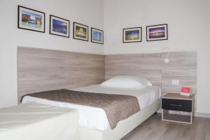 Postel nebo postele na pokoji v ubytování Hotel Citta'