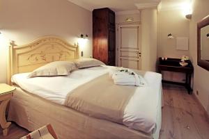 Postel nebo postele na pokoji v ubytování Hotel Doltso