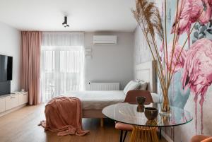 a bedroom with a bed and a glass table at apartamenty-wroc Kurkowa in Wrocław